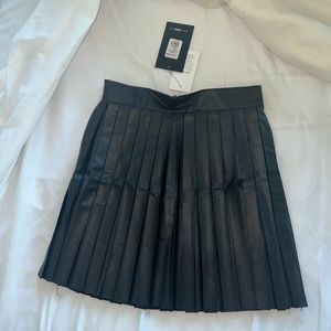 Pleated leather mini skirt